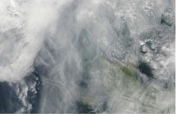 Fig. 19. MODIS image, 1328Z, original resolution 250&nbsp;m. Note complex cloud features The west side of Jersey is visible at the bottom-centre of the picture and the Cherbourg peninsula of the French mainland on the right. Aurigny is obscured by cloud close to the centre of the picture (courtesy Dundee University Satellite Receiving Station).