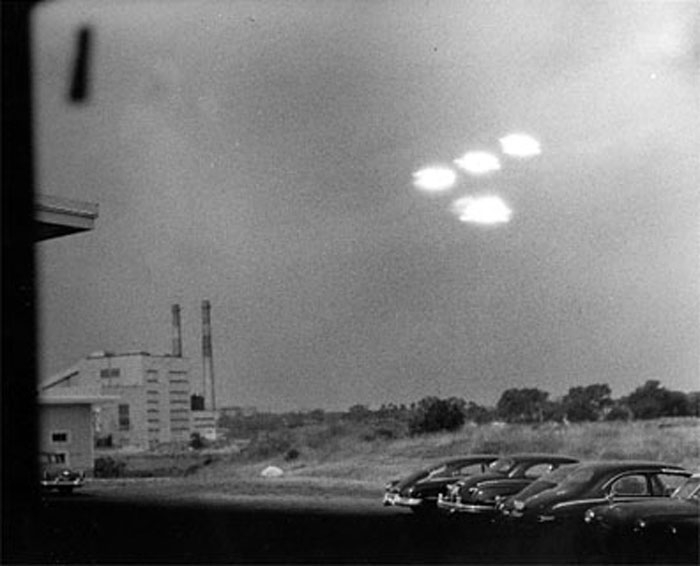 Hovering UFOs, or just searchlights? A US coastguard    took this photo at Salem, Massachusetts in 1952.